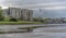 A view down the Carew estuary, past the ruins of Carew Castle towards the Tidal Mill in Pembrokeshire, UK