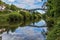 The view down the River Severn of the town of Ironbridge, Shropshire, UK and the bridge that gave it its name