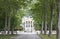 View down a road lined with trees at a French winery