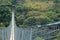 VIEW DOWN SLOPE OF SUSPENSION BRIDGE ACROSS ORIBI GORGE