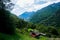 View down the Val Lavizzara over alp with traditional houses near Fusio, Switzerland