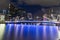View down Yarra River towards Seafarers Bridge and lights of city buildings in long exposure