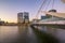 View down Yarra River towards Seafarers Bridge and lights of city buildings in long exposure