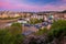 View on downtown Prague bridges and river from romantic Letna view point during early sunset with dusk pink