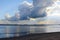 View of dramatic clouds and early sunset looking from Bribie Island over the Pumicestone Passage to the Glass Mountains in Queensl