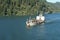 View on dredger ship from a merchant container vessel sailing through Columbia river.