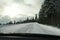 View from driver`s seat on road covered with snow, strong blindi