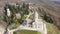 View from drone of architectural complex of Bodbe Monastery with Church of St. Nino on hill slope near Georgian town of