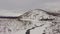 The view from the drone camera to the little unfrozen river, Kamchatka peninsula