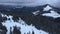 View from drone to landscape in snowbound Carpathians mountains with wooded slopes