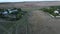 View from drone to the village, dirt roads and cows herd