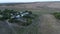 View from drone to the village, dirt roads and cows herd