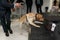 View of a drug detection dog at the airport searching drugs in the luggages