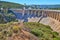 View of the dry spillway of a concrete dam during a long drought