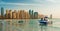 View on Dubai Marina and Jumeirah beach,where people are relaxing and parasailing at the sunset