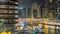 View of Dubai Marina Towers and canal in Dubai night timelapse