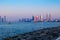 A view of Dubai seaside skyline at sunset. United Arab Emirates.