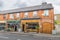 View of Dublin city street side building with shops under the cloudy sky