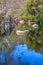 View of DÃƒo river, with trees, rocks and vegetation on the banks, reflections in the water and bright colors