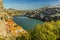 A view eastward along the Douro river in Porto, Portugal on a sunny afternoon