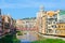 View of Eiffel Bridge across Onyar River, Cathedral and buildings in historical center, Girona, Spain