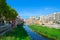 View of Eiffel Bridge over River Onyar, Cathedral and buildings of city of Girona, Spain