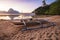 View of El Nido bay with local banca boat in front at low tide, picturesque scenery in the afternoon, Palawan