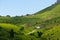 View on the elevator, ski lifts for the pass, cable car, Sella massif green hills. Dolomites, Italy, Beautiful sunny summer day,