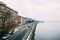 View of the embankment of the Danube River, along which cars travel against the background of old houses in Budapest