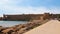 View of the embankment and the medieval fortress, Mandraki Harbour, Rhodes, Greece