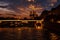 View of the embankment of the Seine River and Notre Dame de Paris at sunset