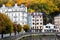 View of embankment of Tepla river and center of Karlovy Vary in autumn