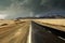 View on empty asphalt highway through arid dry landscape with dark storm clouds and tornado - Atacama desert, Chile