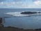 View of empty infinity natural sea pool at Pescante de Hermigua, concrete pillars, ruins of old port, former loading