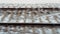 view of the empty snow-covered railway from the train window on a snowy winter day, the railways cross at high speed