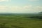 A view of the endless valley under the warm sunny summer sky