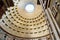 View of entering of pantheon with sun throught the ceiling in rome italy