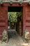 A view of an entrance of a courtyard in a traditional Beijing H