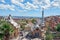 View of the entrance of Park Guell, the work of the architect Gaudi full of tourists with the guard house and the