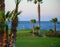 View on evergreen grass field on large golf course and blue Atlantic ocean on Tenerife island, Canary, Spain