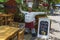 View of exterior decoration of outdoor bistro. Big figure of cook in traditional white clothes welcoming guests at the entrance.