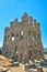 View at the exterior front facade of medieval Saint CornÃ©lio tower, iconic ruins monument building at the Belmonte village,