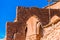 View of the facade of a building in Ait-Ben-Haddou, Morocco. Isolated on blue background