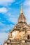 View of the facade of the building of the Shwegugyi temple in Bagan, Myanmar. Copy space for text. Vertical.