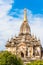 View of the facade of the building of the Shwegugyi temple in Bagan, Myanmar. Copy space for text. Vertical.