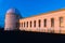 View of the facade of the main building of the historical Lick Observatory (completed in 1888) at sunset; visitors \' shadows