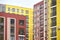 View of the facades of multi-colored multi-storey residential buildings. Fragment of a multi-storey residential building