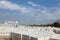 View of factory plant producing autoclaved aerated concrete. Many packages of blocks on pallets put one on the other on an outdoor