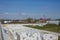 View of factory plant producing autoclaved aerated concrete. Many packages of blocks on pallets put one on the other on an outdoor