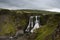 View of the Fagrifoss (Beautiful waterfall) on a cloudy evening, Iceland